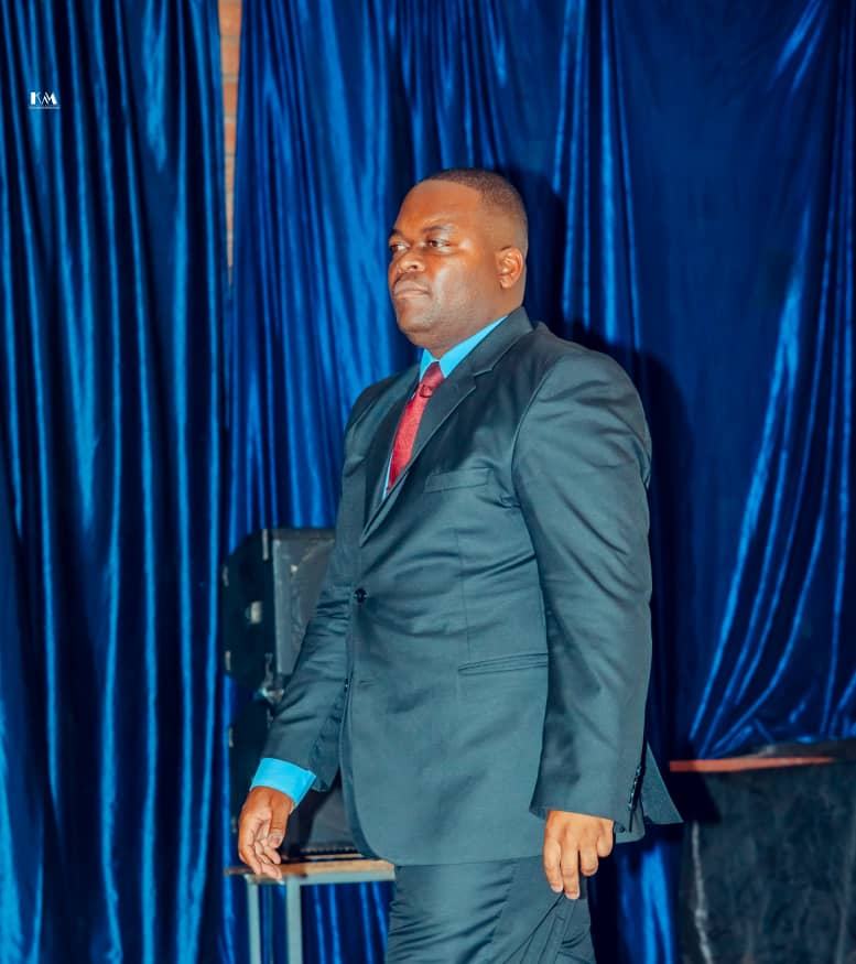 MFM Academy — Speaker beside the stage curtains