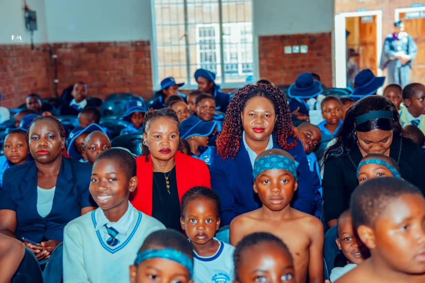 MFM Academy — Families and learners seated in the hall