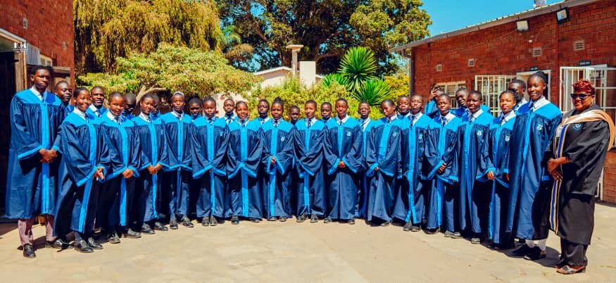 MFM Academy — Choir group gathered outside the school