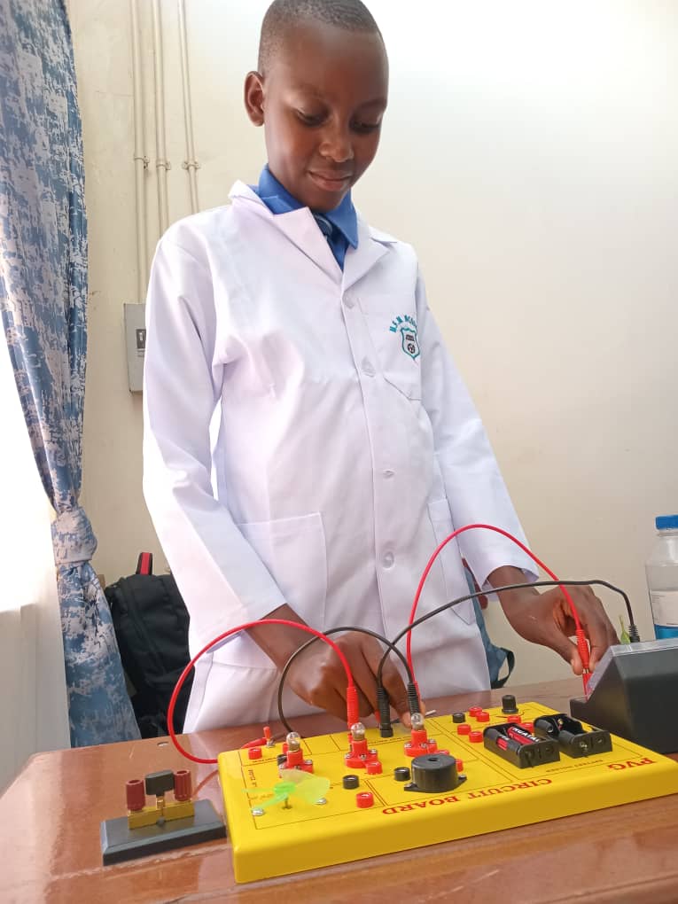 MFM Academy student working on a circuit board in the lab